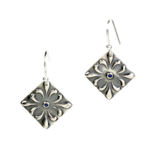 These fun little fine silver ellipse earrings with a center Sapphire are individually hand crafted.