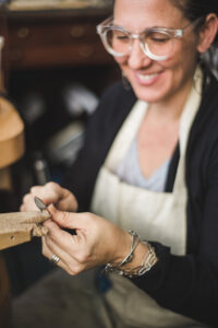 Erica Bailey<br>https://www.esbjewelry.com/  <br>Erica Stankwytch Bailey  Growing up I was always elbows deep involved in some creative endeavor and from an early age I knew that I wanted to be a maker. After graduation from North Carolina School of the Arts with a diploma in the applied arts I attended East Carolina University where I received a BFA in Metal design in 2001. From the first metals survey course I was hooked on metal-smithing, enamored by the malleability of the metal. After graduation I began teaching metal-smithing and jewelry fabrication courses at the local community college. Teaching became an integral part of my creative life.  In 2004 I decided to return to my roots as a maker and founded Erica Stankwytch Bailey Jewelry. In a tiny studio nestled in the backyard of my home in Fayetteville, North Carolina I became the owner, operator, designer and maker of my own handmade business, a dream come true. In the years that have followed my contemporary sterling silver jewelry has found its way around the world. The business is growing and the work is constantly evolving. In 2014 I was given the amazing opportunity to move my family to Asheville, North Carolina, where we now live happily enjoying the beautiful mountains that surround us. My life today consists of creative days in my studio, cherished time with my children, adventures on the road, and quiet moments reflecting on the inspirations found in the smallest of things.