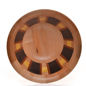 Segmented turned bowl made using Cherry, Walnut, Cherry, Yellow Heart and Brazilian Cherry. No stains are used. All woods are natural color.