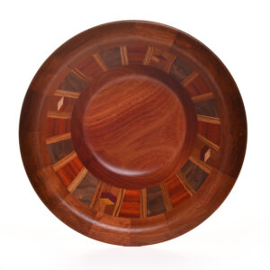 Segmented turned bowl made using Brazilian Cherry, Bloodwood, Walnut and Zebra wood. No stains are used. All woods are natural color.