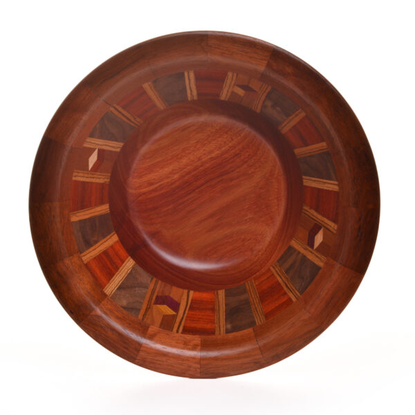 Segmented turned bowl made using Brazilian Cherry, Bloodwood, Walnut and Zebra wood. No stains are used. All woods are natural color.