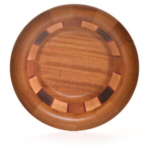 Segmented turned bowl made using Iroka, Oak, Wenge, Brazilian Cherry and Purple Heart. No stains are used. All woods are natural color.