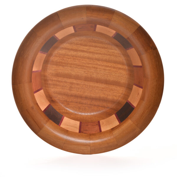Segmented turned bowl made using Iroka, Oak, Wenge, Brazilian Cherry and Purple Heart. No stains are used. All woods are natural color.