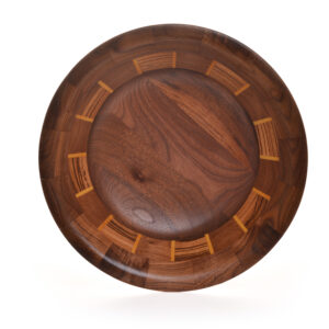 Segmented turned bowl made using Walnut, Zebra Wood and Yellow Heart. No stains are used. All woods are natural color.