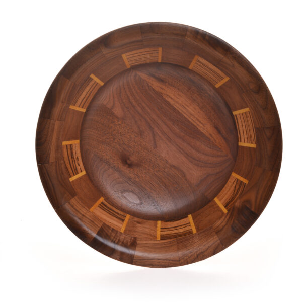 Segmented turned bowl made using Walnut, Zebra Wood and Yellow Heart. No stains are used. All woods are natural color.