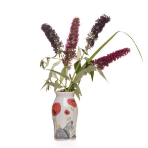 Enjoy your favorite flower arrangement in a sweet and cheerful “Twinkie” cat vase. Meghan’s cat, Twinkie, inspired these sweet cat designs! Each piece is thrown porcelain on the wheel and then carved. After each piece dries the black lines are carved into the porcelain with a sharp knife, then inlaid with black under-glaze. Each color is hand painted before being glazed.