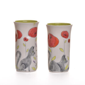 Enjoy your favorite beverage in a sweet and cheerful "Twinkie" cat tumbler. Meghan’s cat, Twinkie, inspired these sweet cat designs! Each piece is thrown porcelain on the wheel and then carved. After it dries, she inlays the carving with black slip and then hand paints the rest of the colors.