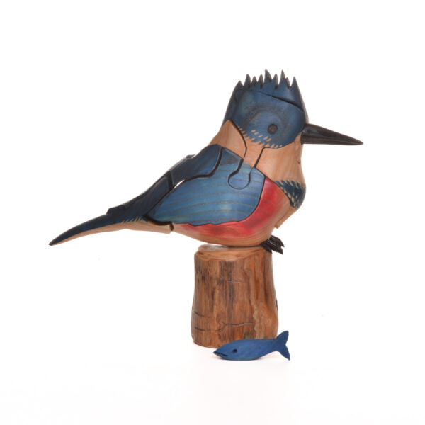 As you take this brightly colored Kingfisher apart, you will find a hidden fish inside. Each piece comes with care and instructions. Growing up in the family wood shop, Peter's son Genesis Chapman has built upon his father's line of puzzles, as well as developed his pursuits in painting and the arts.