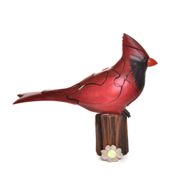 As you take this brightly colored cardinal apart, you will find a hidden dogwood bloom inside. Each piece comes with care and instructions. Growing up in the family wood shop, Peter's son Genesis Chapman has built upon his father's line of puzzles, as well as developed his pursuits in painting and the arts.