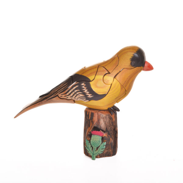 As you take this brightly colored Goldfinch apart, you will find a hidden thistle inside. Each piece comes with care and instructions. Growing up in the family wood shop, Peter's son Genesis Chapman has built upon his father's line of puzzles, as well as developed his pursuits in painting and the arts.