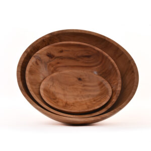 Red Camphor Wood Bowl with Footed Base, Nested Set of 3 by guild members Bill and Tina Collison. An Organic Edge will be on display in the focus gallery upstairs at the Folk Art Center from July 19–October 5, 2025.