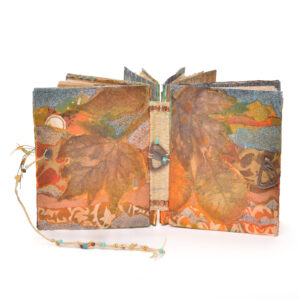 Always Autumn by guild member Mary Alice Ramsey. "An Organic Edge" will be on display in the focus gallery upstairs at the Folk Art Center from July 19–October 5, 2025.