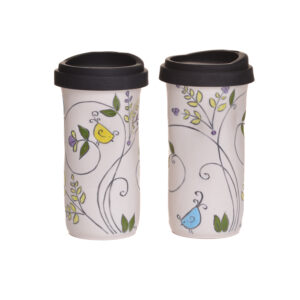 Enjoy your favorite beverage on the go with a fun and whimsical Swirly Gig Birds travel mug. When artist Meghan Bernard created this design, she was inspired by a family of House Wrens that invades her studio every spring. Each piece is thrown porcelain on the wheel and then carved. After it dries, she inlays the carving with black slip and then hand paints the rest of the colors.