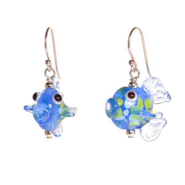 These charming fish critter earrings have been created over a torch. Teresa Brittain creates glass beads over a torch, using the centuries-old technique of lampworking, then combines the beads with sterling silver findings and chains to create unique pieces of wearable art.