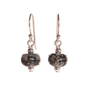 Black and ivory glass bead with fine silver frit earrings created over a torch. Teresa Brittain creates glass beads over a torch, using the centuries-old technique of lampworking, then combines the beads with sterling silver findings and chains to create unique pieces of wearable art.