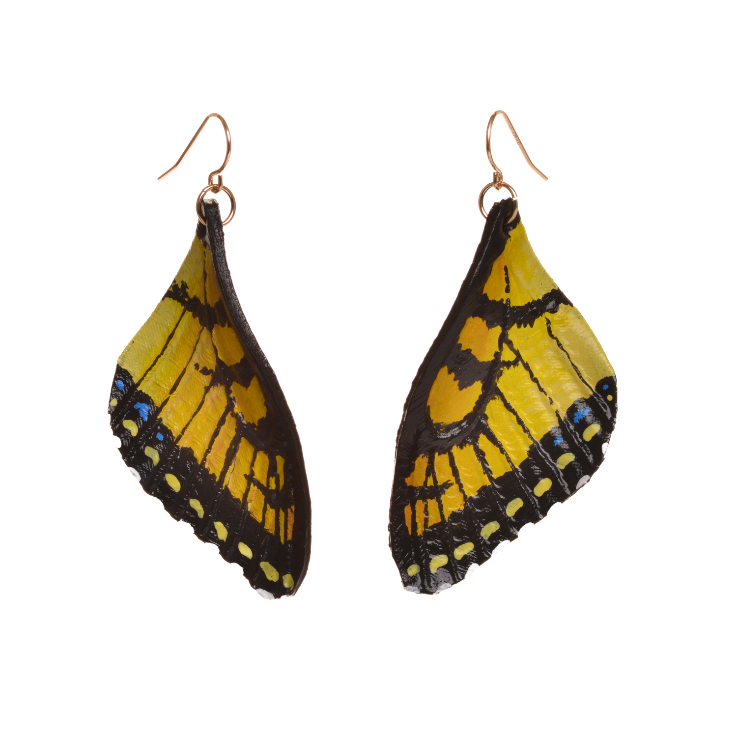Tiger swallowtail butterfly earrings, hand tooled and painted on veg tanned leather. Thin, slightly flexible and very light. The design is drawn on the leather, tooled, cut out and shaved down thin. They are then soaked with a leather dye that stiffens the leather, and shaped as they dry. Finished with a coat of clear sealer.