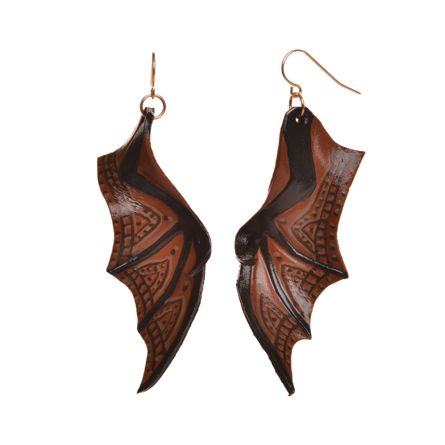 Bat wing earrings, hand tooled and painted on veg tanned leather. Thin, slightly flexible and very light. The design is drawn on the leather, tooled, cut out and shaved down thin. They are then soaked with a leather dye that stiffens the leather, and shaped as they dry. Finished with a coat of clear sealer.
