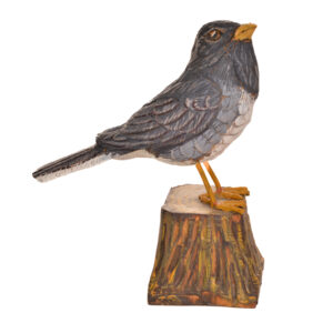 Realistic hand carved and painted Junco. Masterfully painted and posed. John Dickens carves each piece with an ordinary pocketknife. John has been carving wood for 48 years. John wrote, "each time I do an animal, I want to do it in a different pose so I can learn more about its anatomy and how it moves and behaves." His primary subjects are the local songbirds found at his backyard bird feeder, animals, fish, people and reliefs.