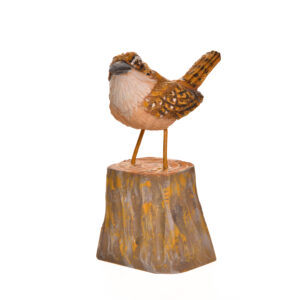 Realistic hand carved and painted Carolina Wren. Masterfully painted and posed. John Dickens carves each piece with an ordinary pocketknife. John has been carving wood for 48 years. John wrote, "each time I do an animal, I want to do it in a different pose so I can learn more about its anatomy and how it moves and behaves." His primary subjects are the local songbirds found at his backyard bird feeder, animals, fish, people and reliefs.
