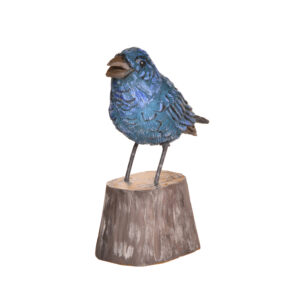Realistic hand carved and painted Bluebird. Masterfully painted and posed. Artist John Dickens has been carving wood for 48 years. John wrote, "each time I do an animal, I want to do it in a different pose so I can learn more about its anatomy and how it moves and behaves." His primary subjects are the local songbirds found at his backyard bird feeder, animals, fish, people and reliefs.