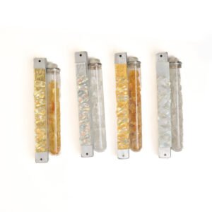 Uniquely designed mezuzah specially made for the broken glass of your wedding. A gift to be cherished for a lifetime. The glass design is laminated on top of a closed aluminum casing. Artist Alicia Kelemen creates these Mezuzot to place outdoors or indoors, so they can stand extreme climate conditions.