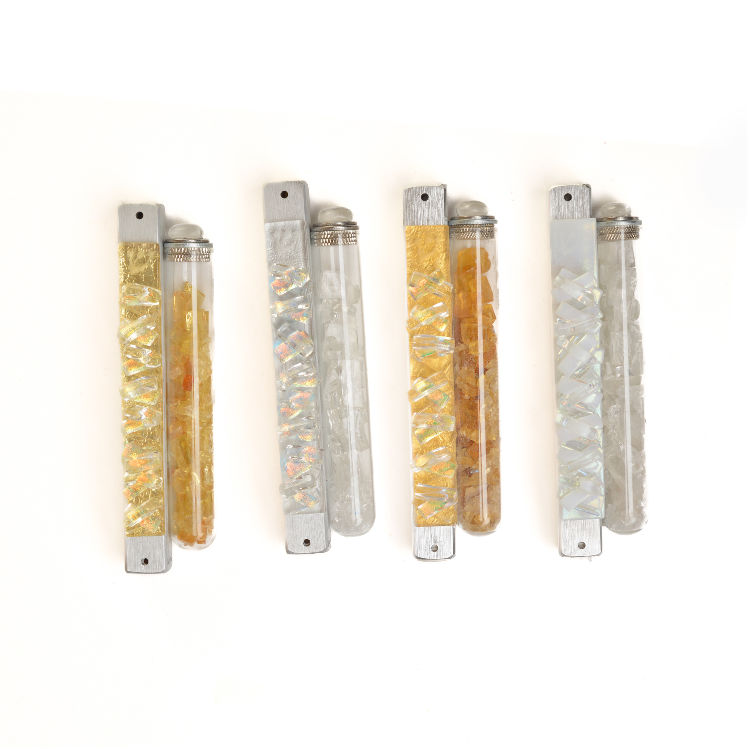 Uniquely designed mezuzah specially made for the broken glass of your wedding. A gift to be cherished for a lifetime. The glass design is laminated on top of a closed aluminum casing. Artist Alicia Kelemen creates these Mezuzot to place outdoors or indoors, so they can stand extreme climate conditions.