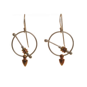 Handcrafted earrings with a circle and bar design accented with silver, copper and brass by silversmith Barbara Joiner of North Carolina.