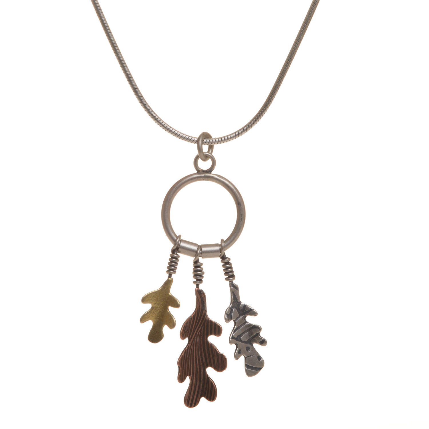 Handcrafted pendant with embossed silver, copper, and brass leaves by silversmith Barbara Joiner of North Carolina.