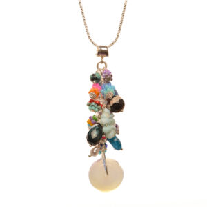 This unique pendant features a cluster of dangly gems and and handwoven glass seed beads by jeweler Leslie Fawcett of Tennessee. With a needle and nylon thread, Leslie takes tiny glass seed beads and weaves them into larger beads that are then rolled up and sewn together. The use of the peyote stitch allows the ends of the discs to interlock when sewn together, and repeated passes through the beads reinforce the whole. Leslie uses a variety of gemstones, lampwork beads and sterling silver findings that she has purchased over the years to enhance and complement the beads that she has created.