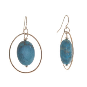 Handcrafted sterling silver hoops with turquoise earrings by silversmith Suzanne Farran-Hrytzik of North Carolina. This simple yet elegant design ensures the vibrant color of the turquoise stands out. Easy to clean and great for everyday wear. Expect slight variations in design.