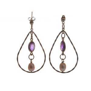 Beautifully designed and handcrafted sterling silver and amethyst teardrop earrings by silversmith Suzanne Farran-Hrytzik of North Carolina. The combination of twisted silver, vibrant amethyst, and a classic pearl makes these earrings suitable for both casual wear and special occasions.