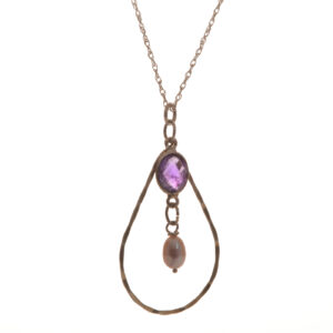 Beautifully designed and handcrafted sterling silver and amethyst teardrop necklace by silversmith Suzanne Farran-Hrytzik of North Carolina. The combination of twisted silver, vibrant amethyst, and a classic pearl makes this piece suitable for both casual wear and special occasions.