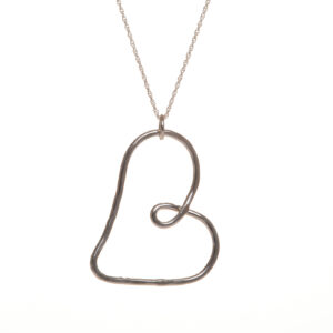 Beautifully designed and handcrafted sterling silver "Love and Friendship" heart necklace by silversmith Suzanne Farran-Hrytzik of North Carolina. This piece features a playful sterling silver hammered heart. Great for everyday wear. Expect slight variations in design. Easy to clean and great for everyday wear. Expect slight variations in design.