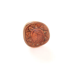 Original designs hand-painted on mountain rocks by Mänya Pirkle of Tennessee. Each piece is inspired by fossils, pottery, and cave paintings—representing traces of human existence that have survived the ages.