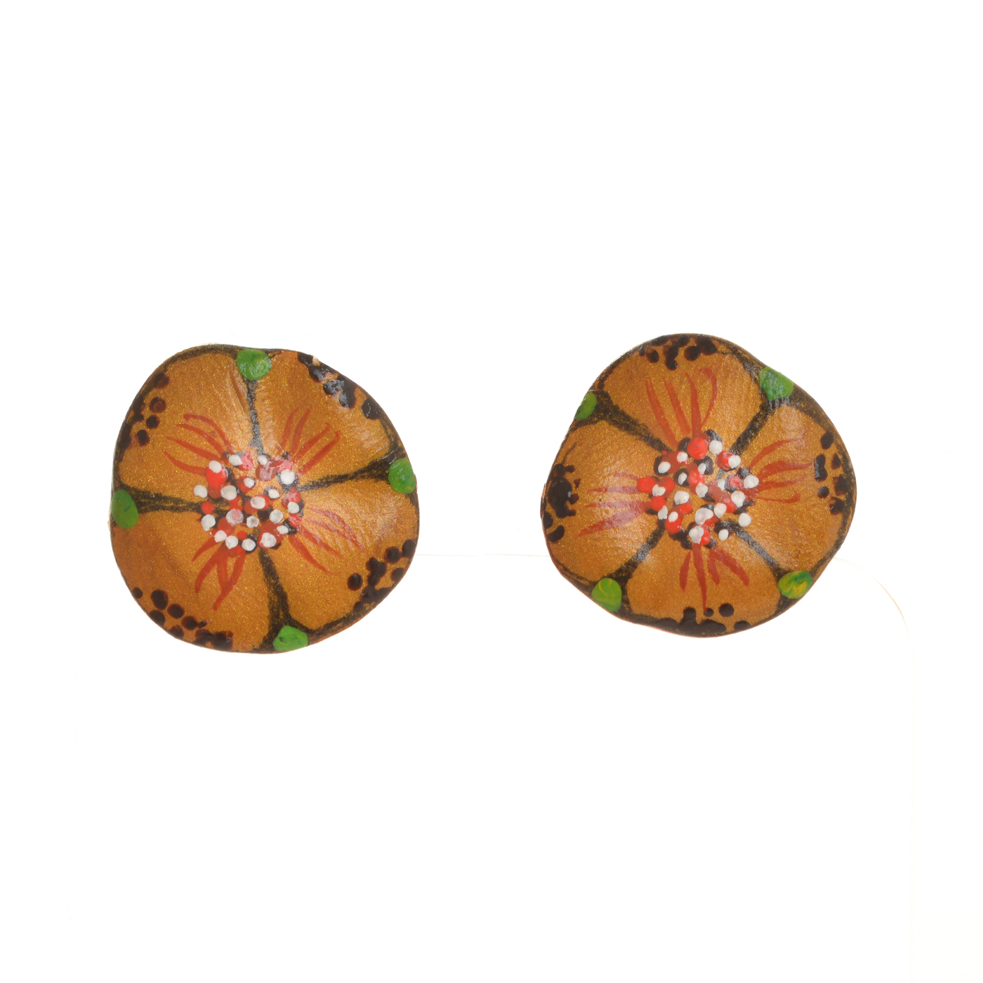 Original designs hand-painted on sunbaked paper clay by Mänya Pirkle of Tennessee. Each piece is inspired by fossils, pottery, and cave paintings—representing traces of human existence that have survived the ages.