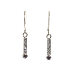 Delicate silver drop earrings featuring a sleek, textured bar design accented with a sparkling purple amethyst, biologically inspired and designed by Charity Hall of Virginia.