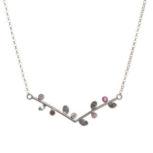 Sterling silver necklace featuring a graceful V-shaped vine, adorned with tiny leaves and sparkling stones, biologically inspired and designed by Charity Hall of Virginia.