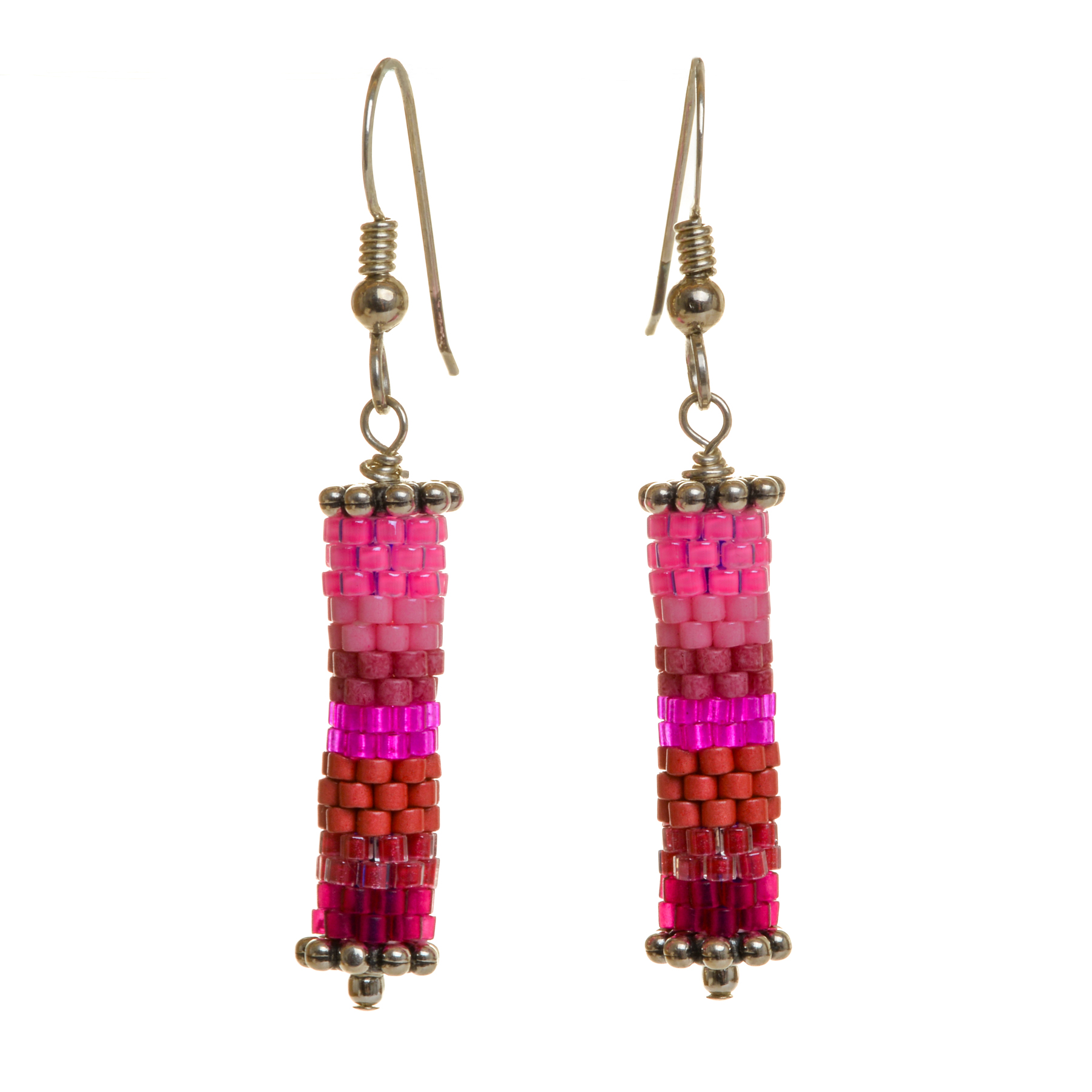 Round tube earrings featuring handwoven glass seed beads by jeweler Leslie Fawcett of Tennessee. With a needle and nylon thread, Leslie takes tiny glass seed beads and weaves them into larger beads that are then rolled up and sewn together. The use of the peyote stitch allows the ends of the rectangle to interlock when sewn together, and repeated passes through the beads reinforce the whole. Different colors available.