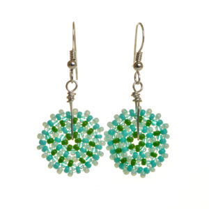 Round disc earrings featuring handwoven glass seed beads by jeweler Leslie Fawcett of Tennessee. With a needle and nylon thread, Leslie takes tiny glass seed beads and weaves them into larger beads that are then rolled up and sewn together. The use of the peyote stitch allows the ends of the rectangle to interlock when sewn together, and repeated passes through the beads reinforce the whole. Different colors available.