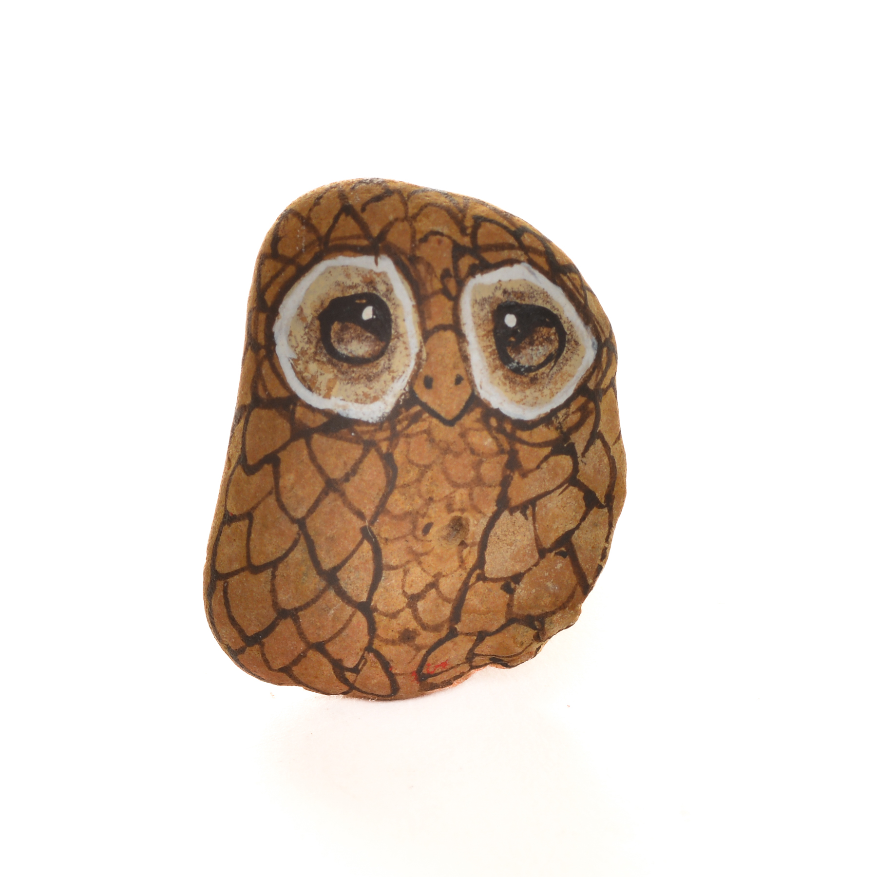 Hand painted river rock owl pin by Mänya Pirkle of Tennessee. Each pin features a natural river stone sourced from the mountains, transformed into a whimsical owl with unique features. No two owls are exactly alike, making each pin a special, wearable piece of folk art.