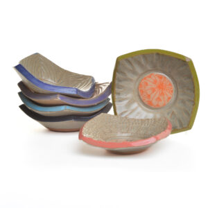 Tiny slab-built stoneware tray that combines functional design with intricate botanical artistry by North Carolina potter Robin Kirby Bryant. The original designs are hand-carved and painted on each piece. No two are alike, though they will share the feeling of belonging together. Dishwasher and microwave-safe. Different colors and designs available. Each sold separately.