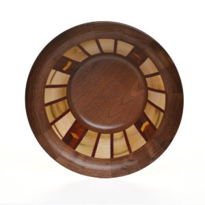 Segmented turned bowl made using walnut, maple, purpleheart, yellowheart, and padauk. No stains are used. All woods are natural color.