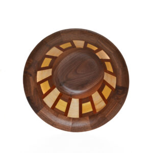 Segmented turned bowl made using walnut, maple, and padauk. No stains are used. All woods are natural color.