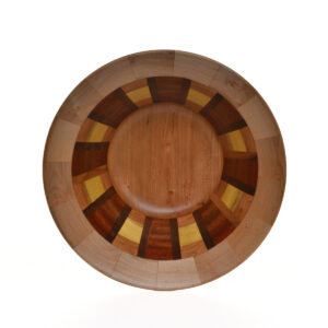 Segmented turned bowl made using maple, walnut, cherry, and yellowheart. No stains are used. All woods are natural color.