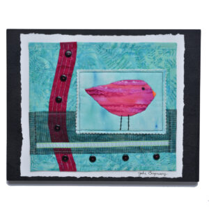 Add a touch of handmade charm to any space with this "Standing Watch" layered fabric wall hanging by artist Julie Bagamary. This piece features striking batik and hand-dyed fabrics, combined with detailed hand embroidery and unique embellishments, these artworks are crafted to make a statement in any space. Signed by the artist. Custom hanging wire on back.