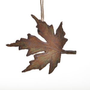 Handcrafted maple leaf ornament or gift tag, created by North Carolina potter Rebecca Regal. Her ceramics combine hand-building, wheel-throwing, and sculptural techniques, drawing inspiration from Appalachian nature, folklore, and rustic charm. Most of the glazes she uses are original glaze recipes curated by her potter father for over 50 years. Each piece is produced in small batches and is one of a kind. Different options available. Each sold separately. 