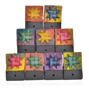 Colorful handmade paper birdhouse ornament by artist Claudia Lee of Liberty, Tennessee. Each birdhouse is one-of-a-kind, handcrafted, and made with decorative papers.