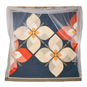 Janet Purcell 2026, cotton fabric, cotton batting, tulle, trim; machine pieced and quilted 82” x 82”