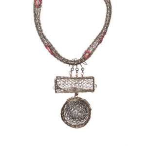 Sharon Bass 2026, fine silver, copper, painted cotton (acrylic paint), cheesecloth; crocheted and free-form wire 3 ¾” x 2 ¾” x ¾” with 18” to 20” chain