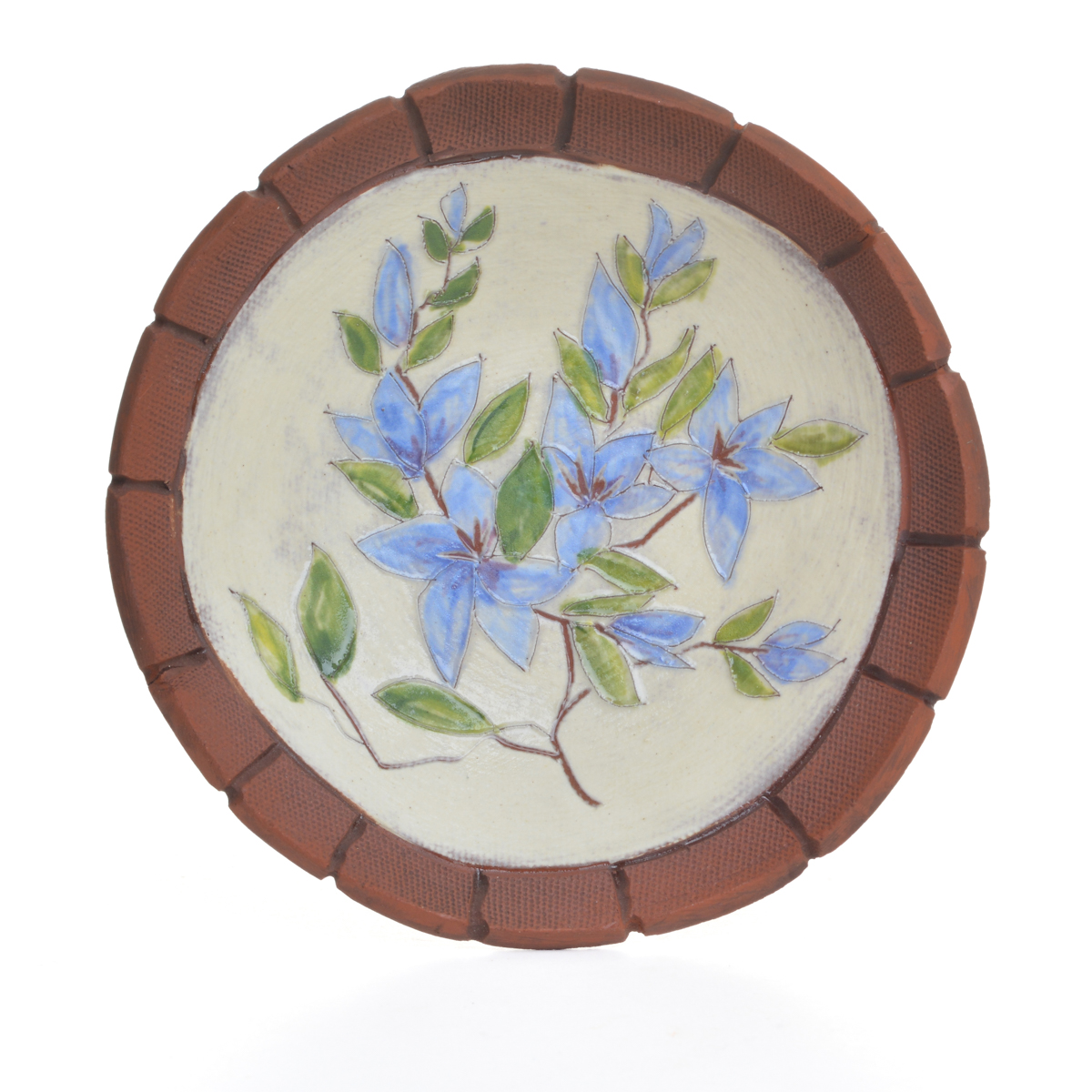 Small hand-made floral ceramic dish featuring hand-built, hand-painted pieces that contrast the rawness of the earthenware with a “canvas” of white slip, on which a botanical scene has been applied in underglazes. Each dish is “framed” by raw clay, like a painting or looking through a window. Each sold separately. Different colors available.
